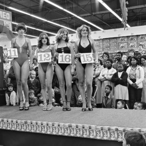 Goldblatt. Saturday morning at the hypermarket, Semifinal of the Miss Lovely Legs Competition, 1980